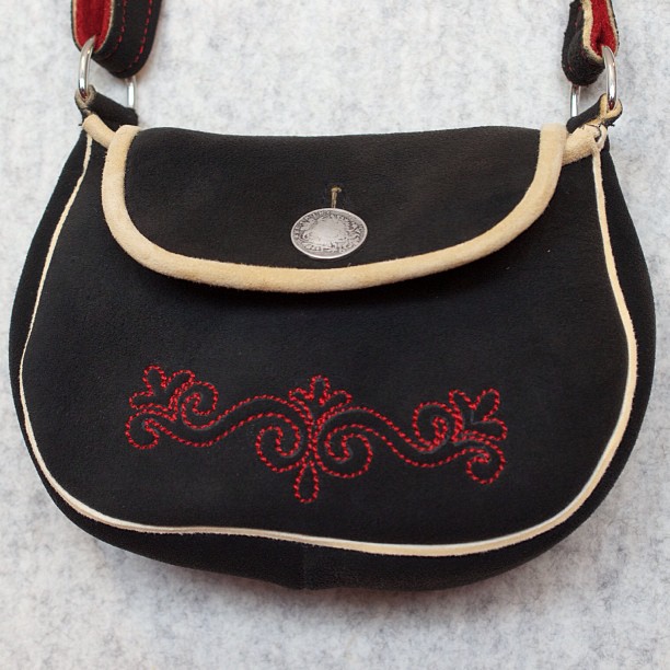 a close up of a purse with beaded trim
