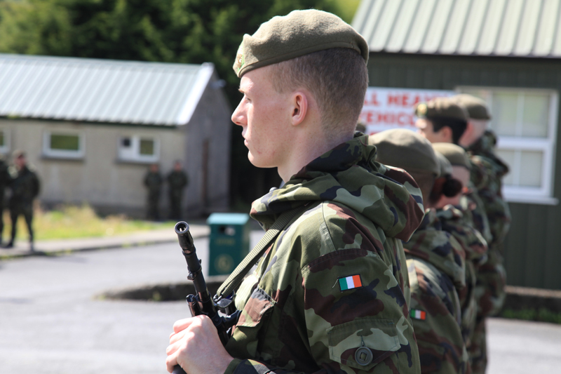 a group of soldiers standing in the street together