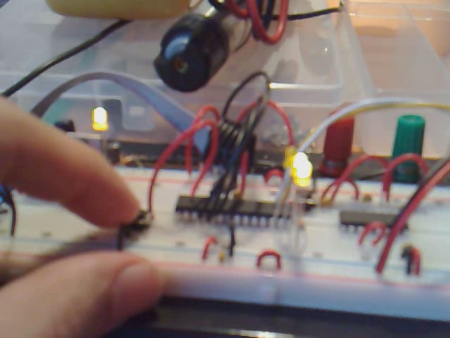 the electronic components are being worked on by a person