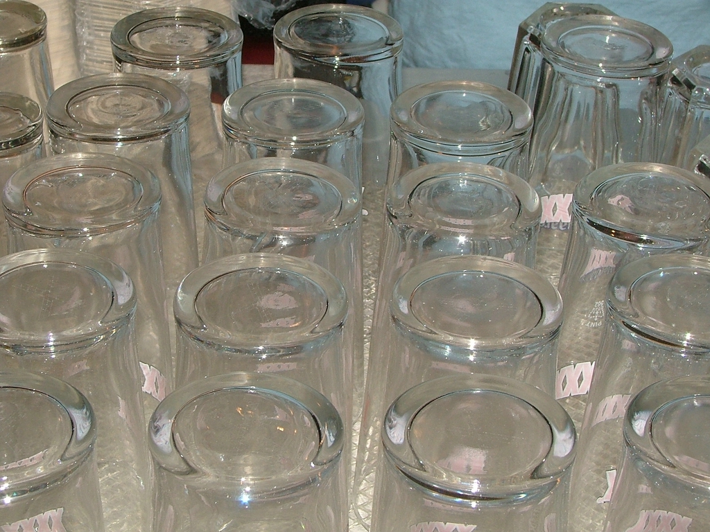 many different clear jars are piled on each other