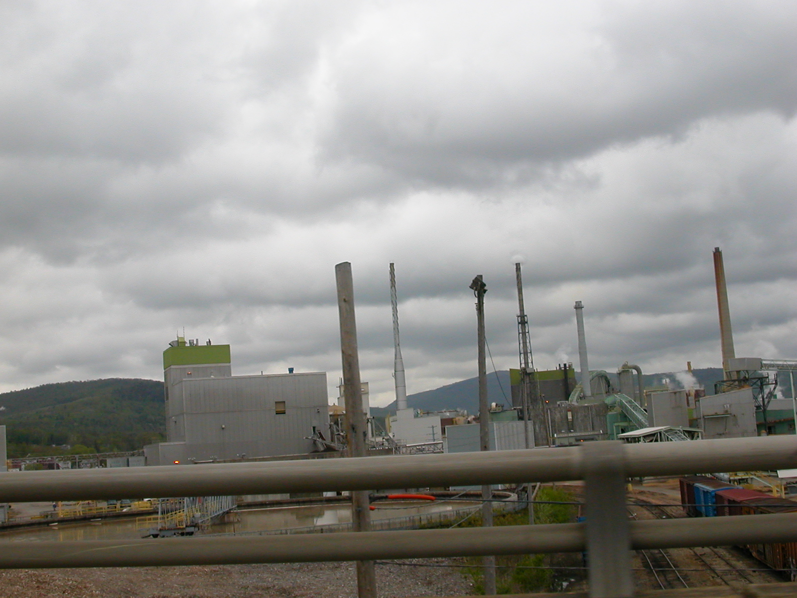 a view of a factory from the ground