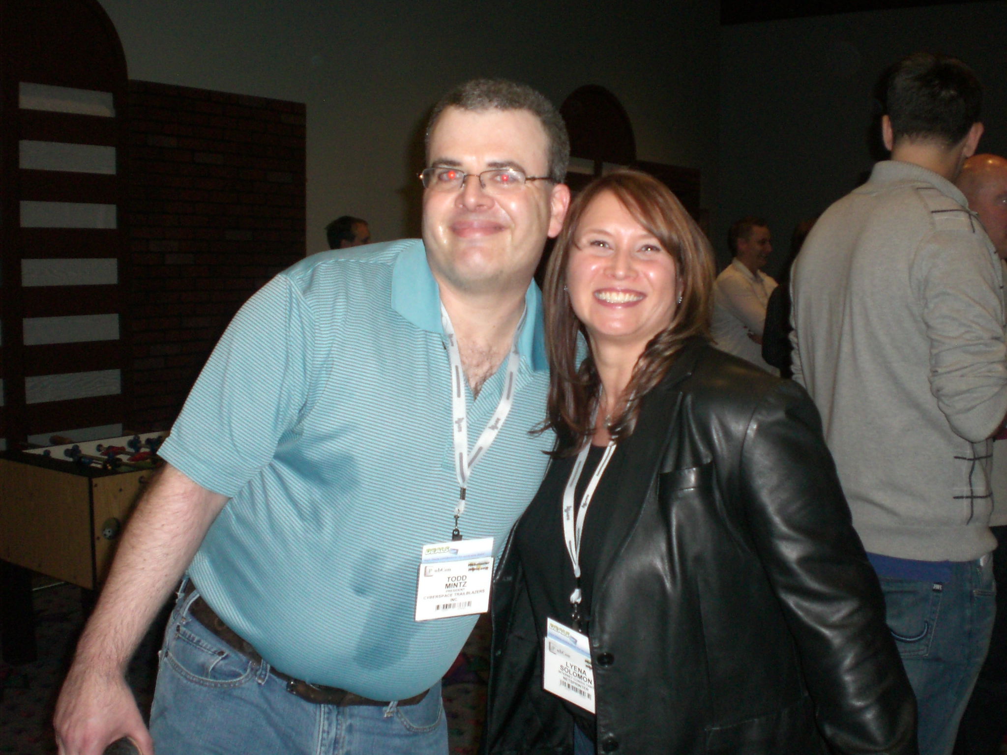 the man is posing for a picture with his wife