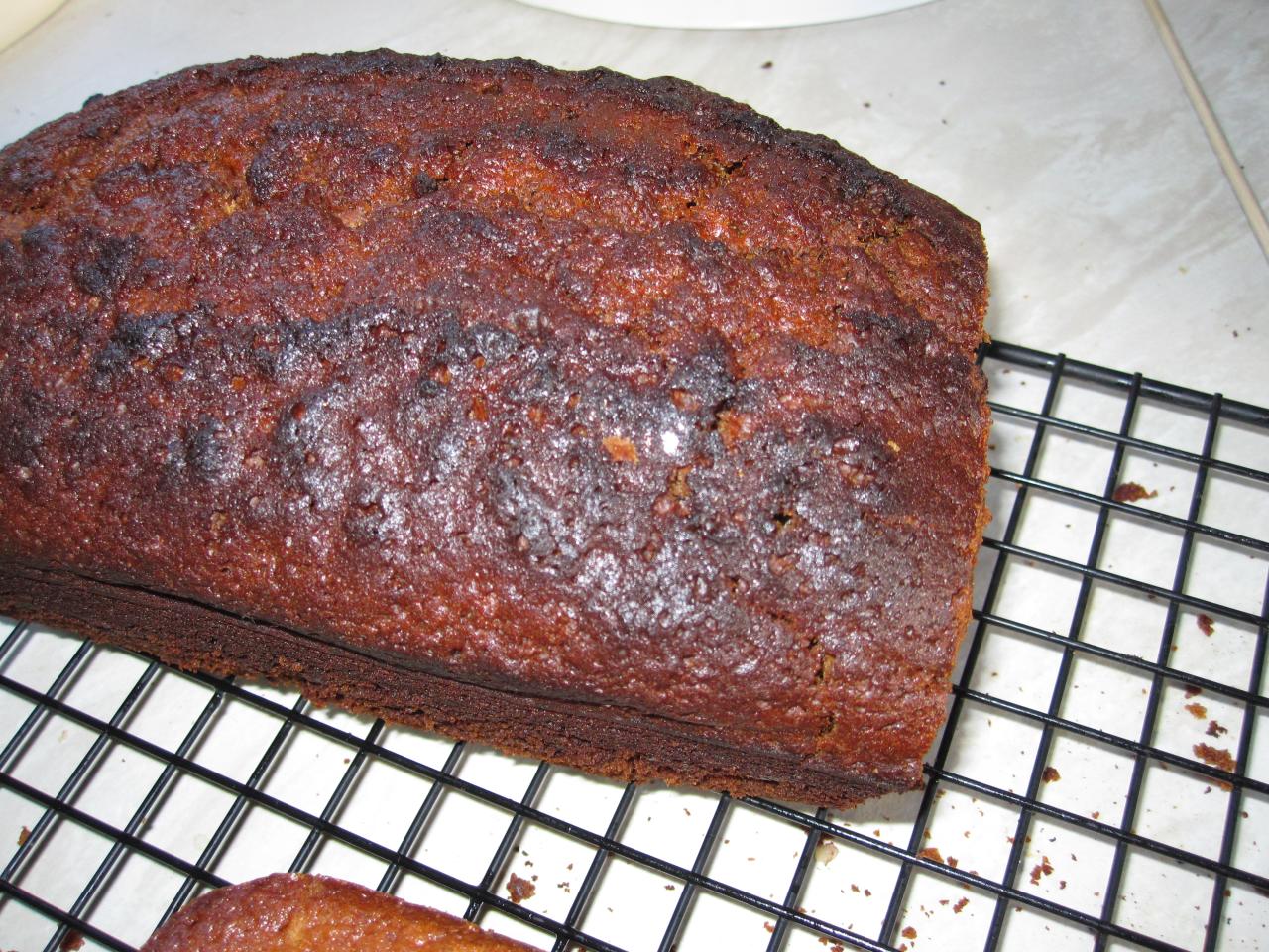 there is a loaf of cake on a cooling rack