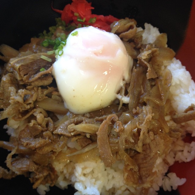 a meat and rice dish is on top of a plate