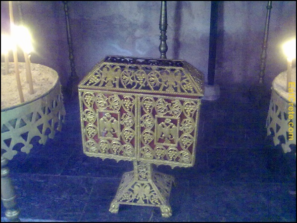 an ornately decorated gold chest stands in a room