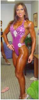 woman in purple body suit posing for the camera