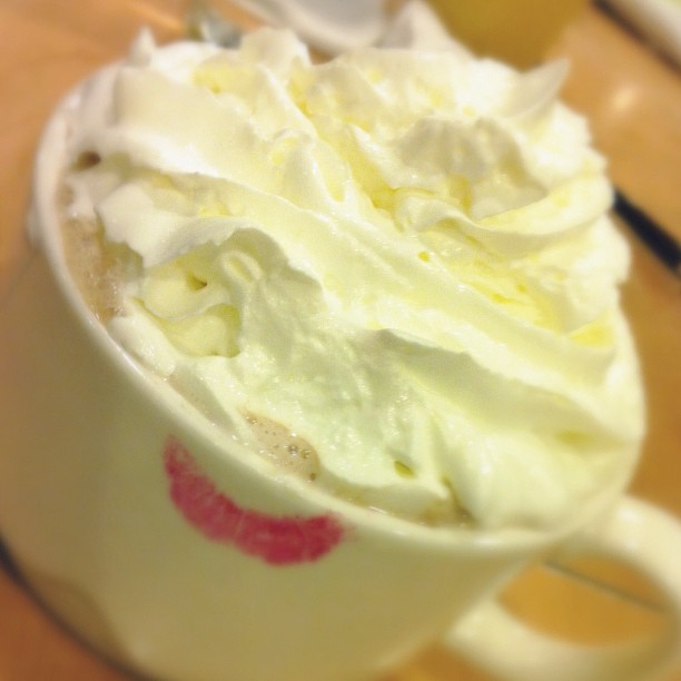 whipped cream in a cup that has been turned on