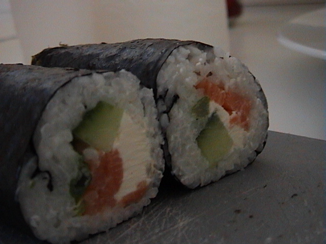 a roll of sushi that looks like it is cut in half