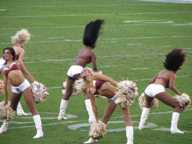 the women are dressed in cheerleader attire