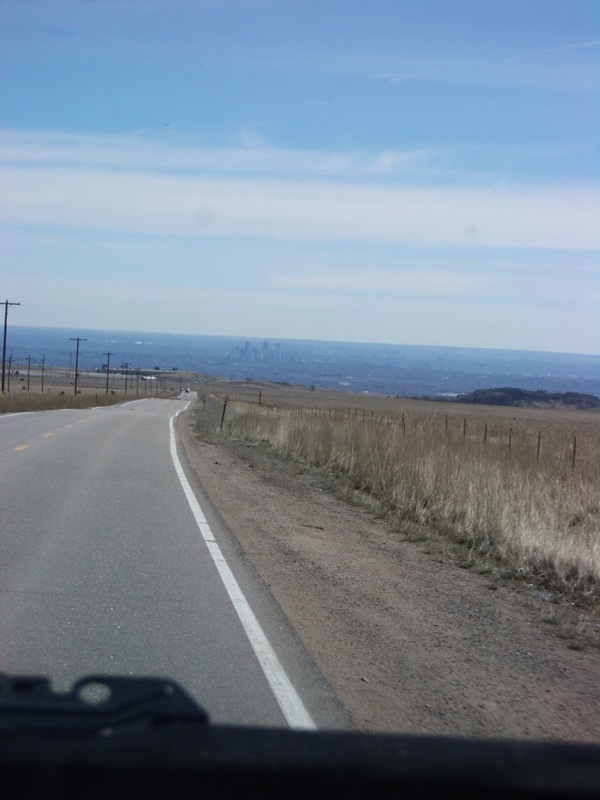 the view from inside a car looking at an empty road