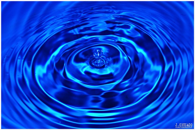 a blue abstract water pattern with wavy waves