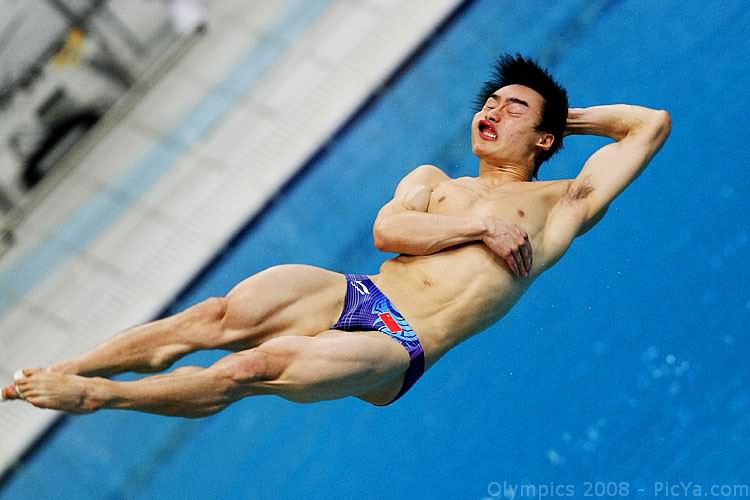 a man who is diving into an empty swimming pool
