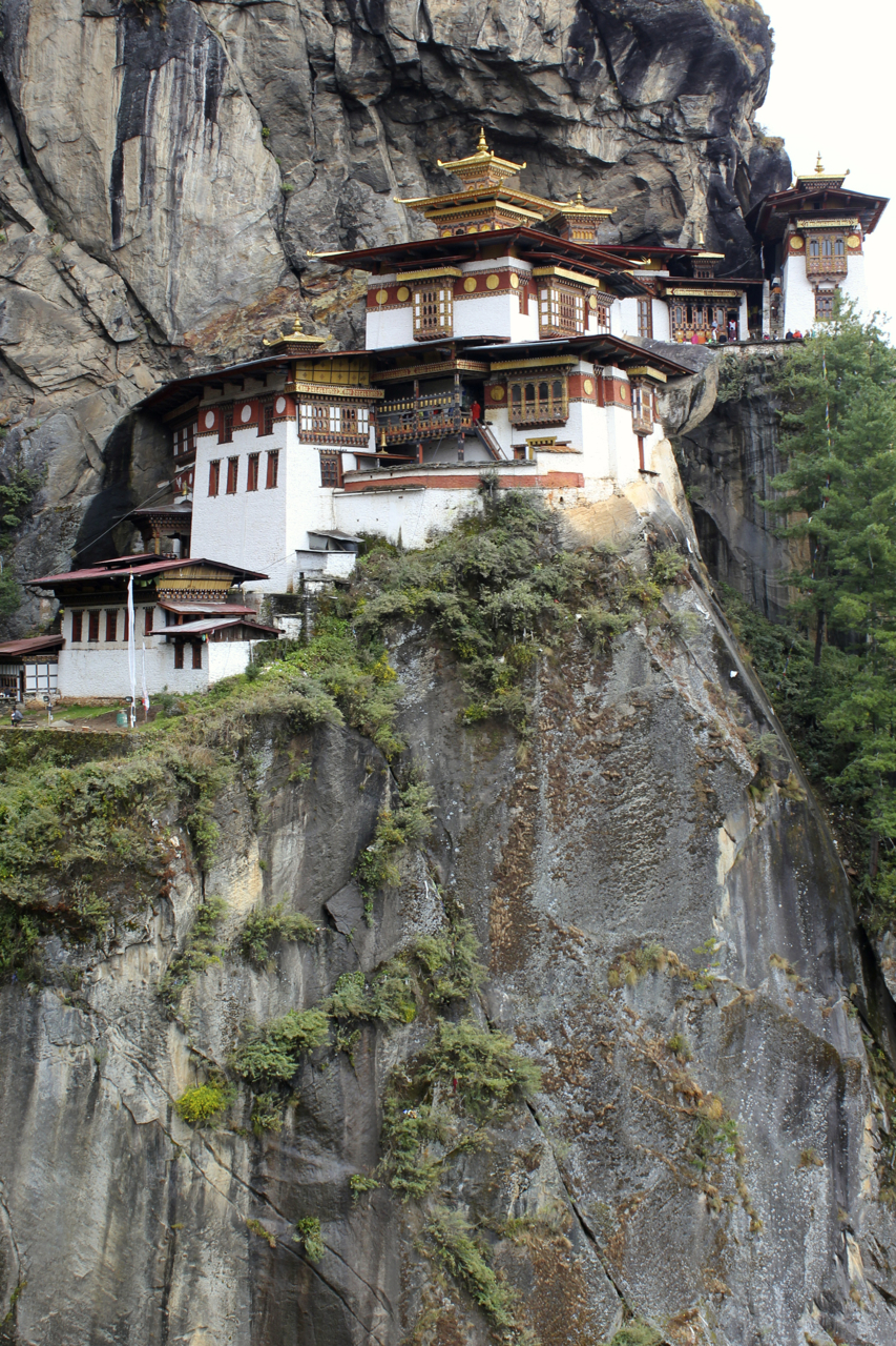 a group of buildings sit on the side of a mountain