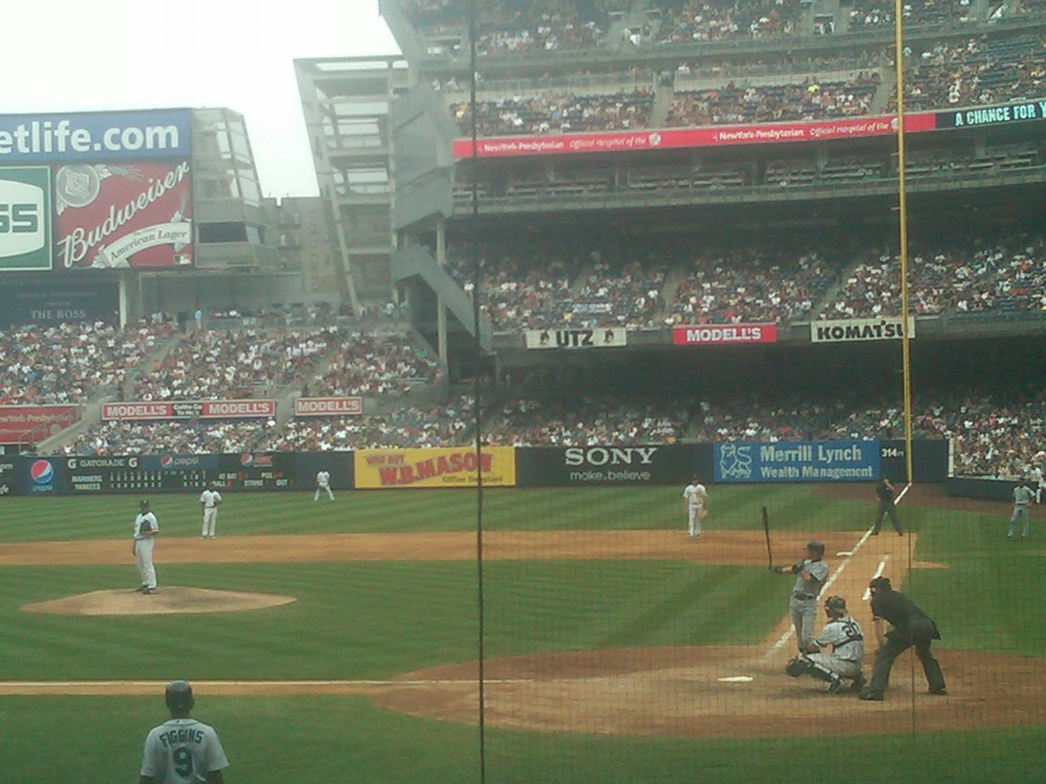 a baseball game in progress as the batter waits for the pitch