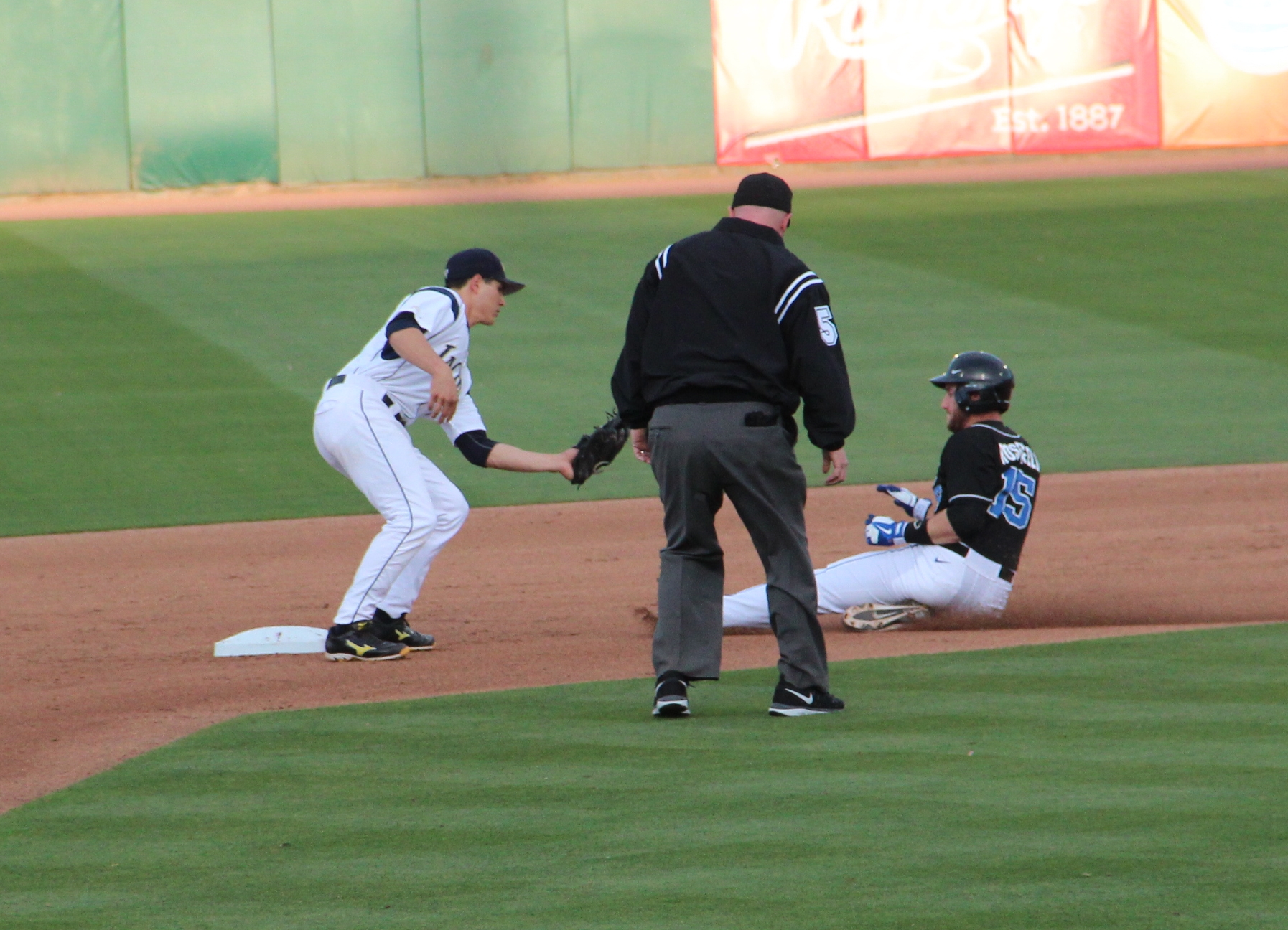 a baseball player sliding into a base during a game