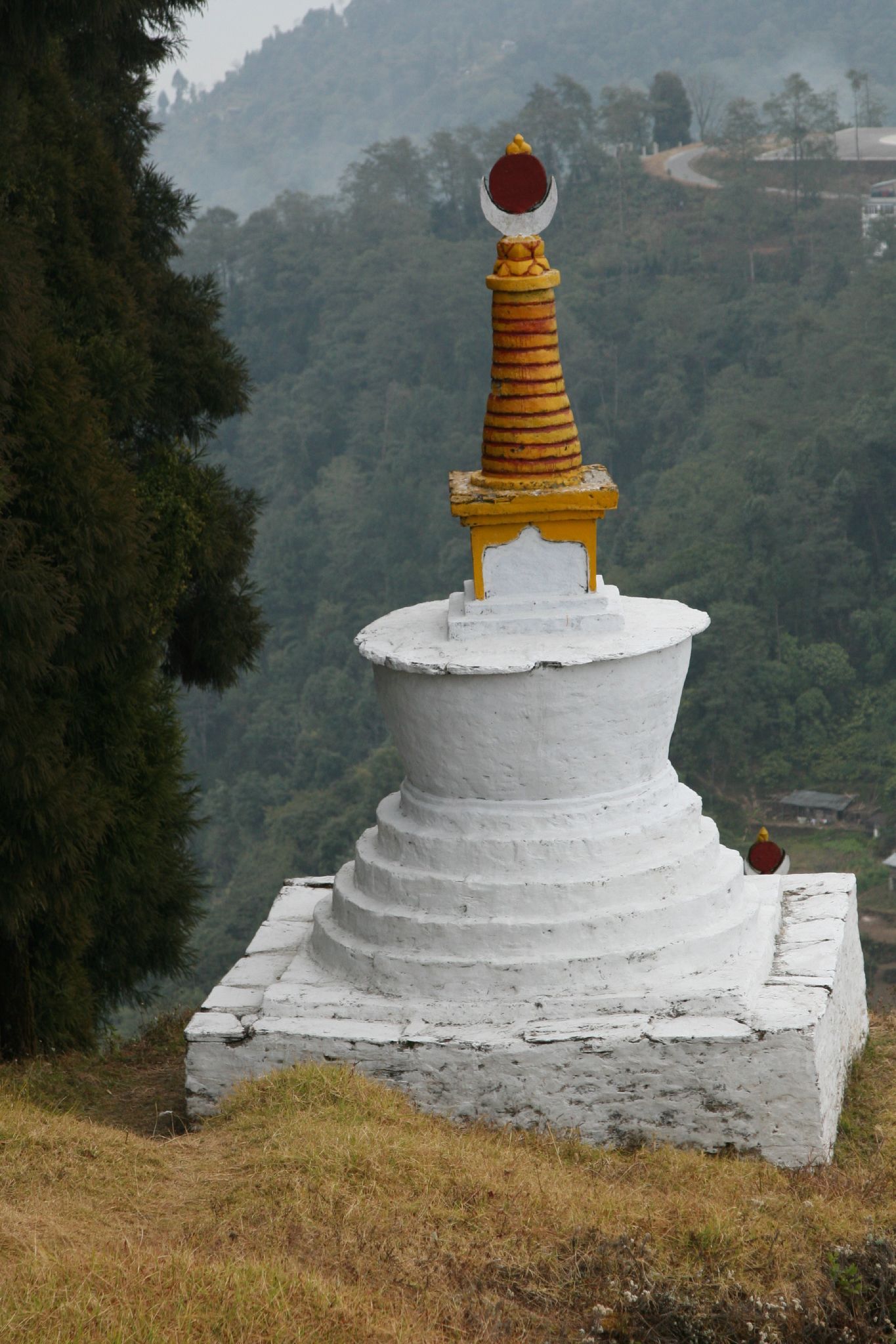 a buddhist temple on the side of a hill
