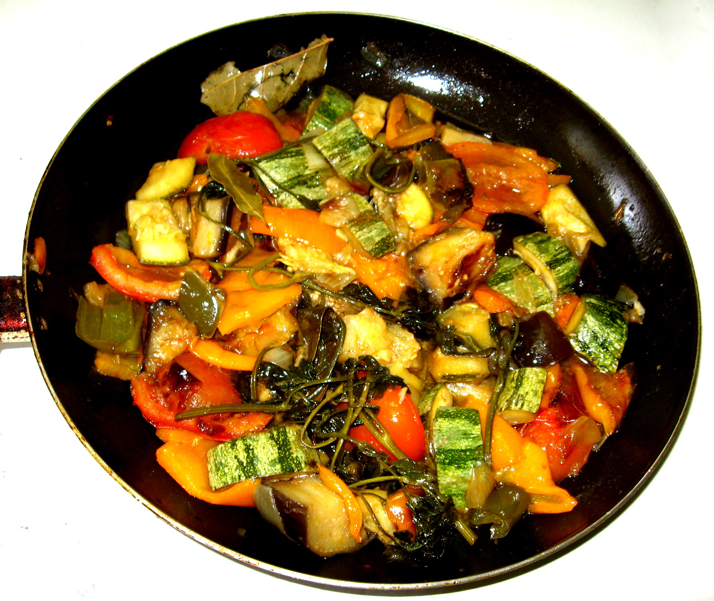 a set with a colorful stir fry of vegetables