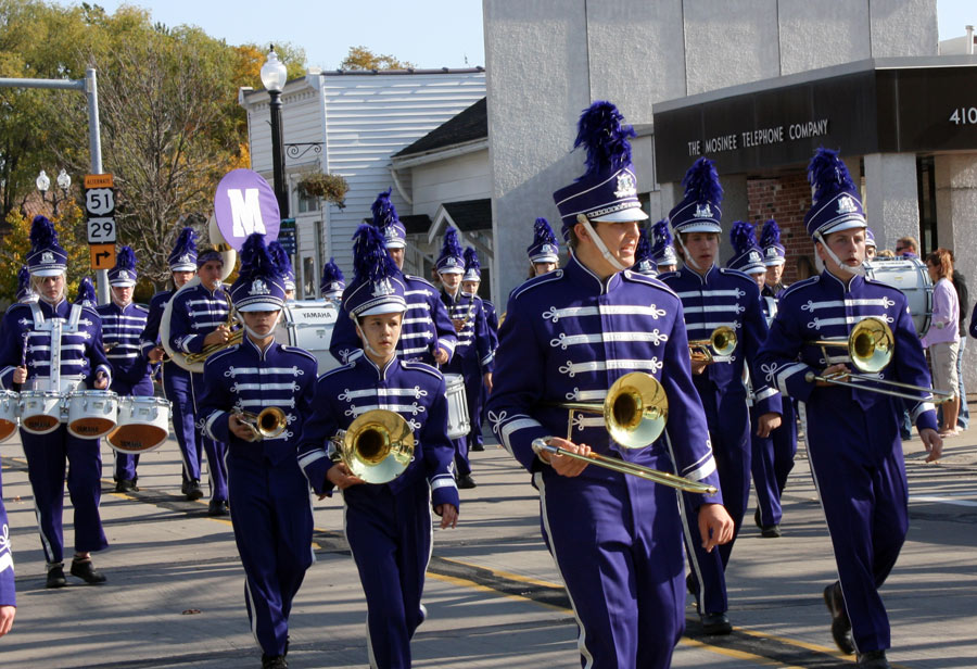 the band is in full uniform for a parade