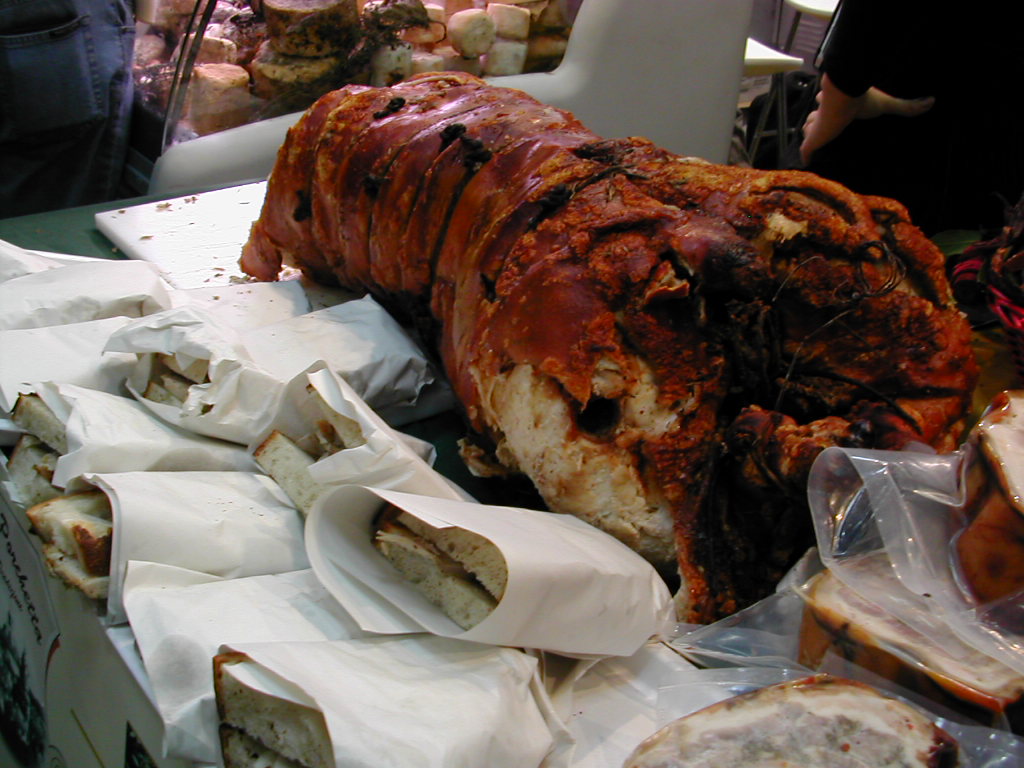 a large amount of food is spread out on tables