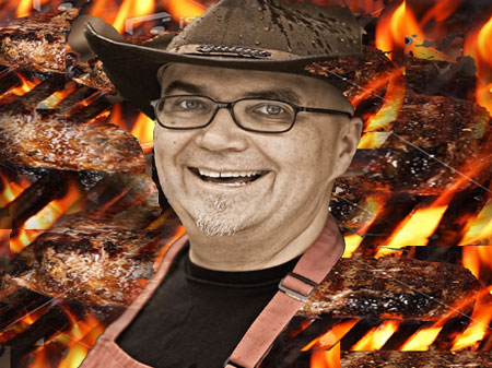 an image of a man with glasses and hat in front of some chicken on a grill