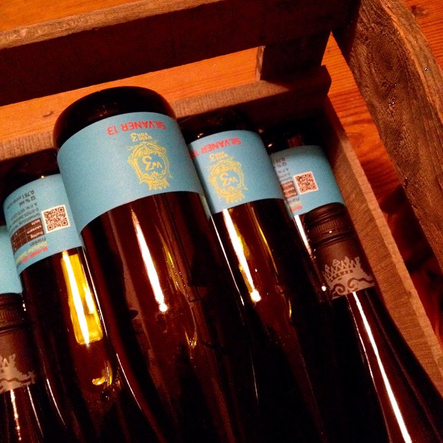 a group of wine bottles in a case