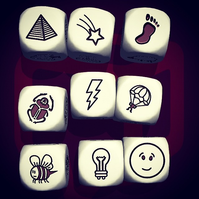 a white dice with different symbols and pictures