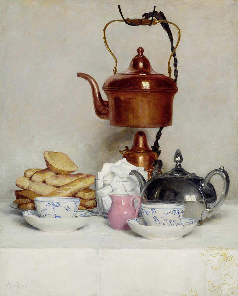 some teapots and other items are on a table