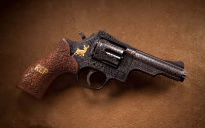 a gun on a brown background, which is on the floor
