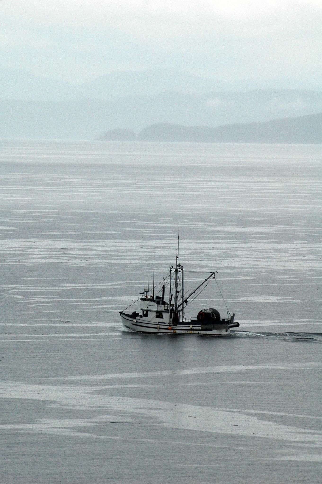 a boat is traveling on calm water in the ocean