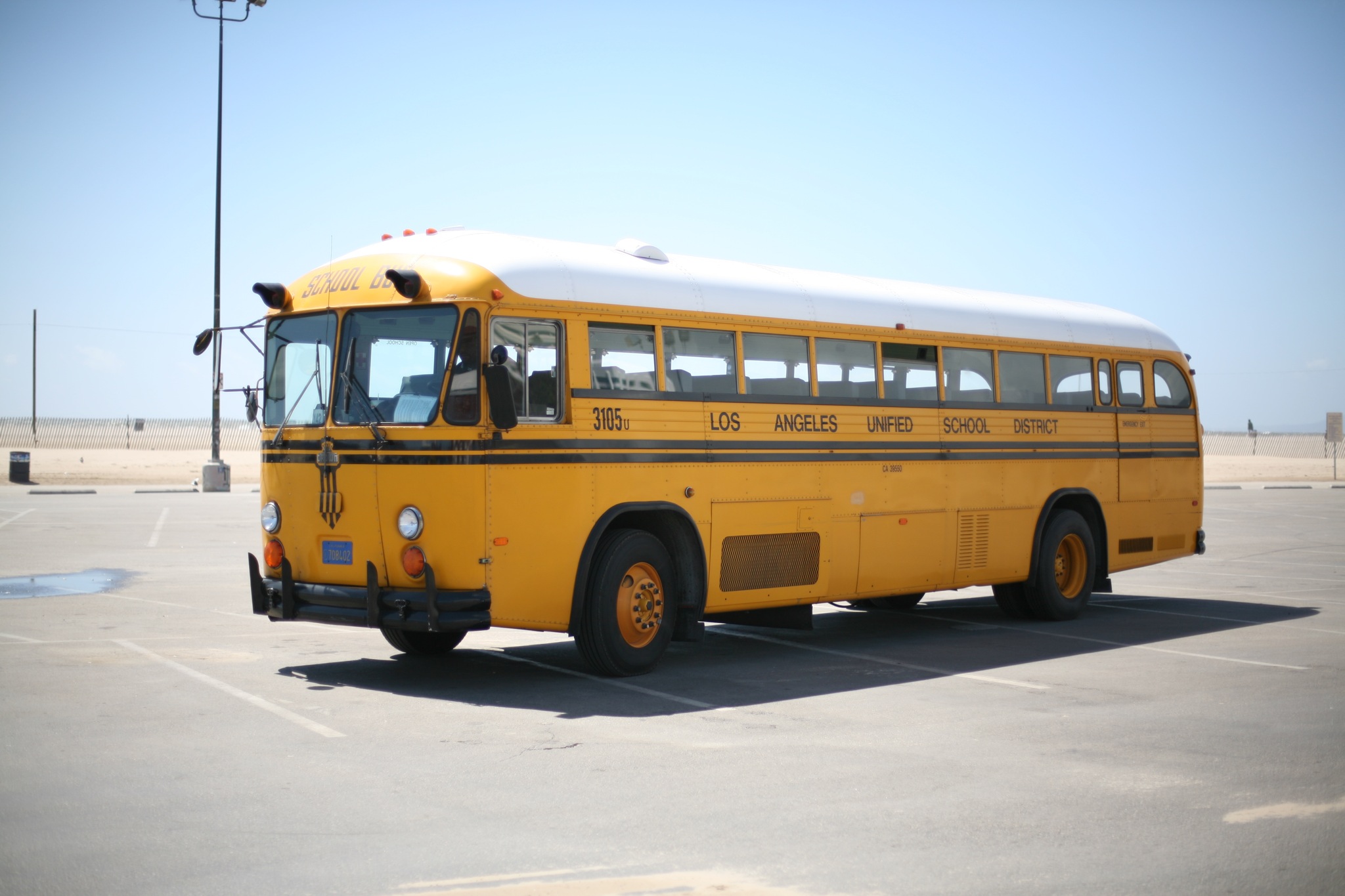 a yellow school bus parked in a parking lot