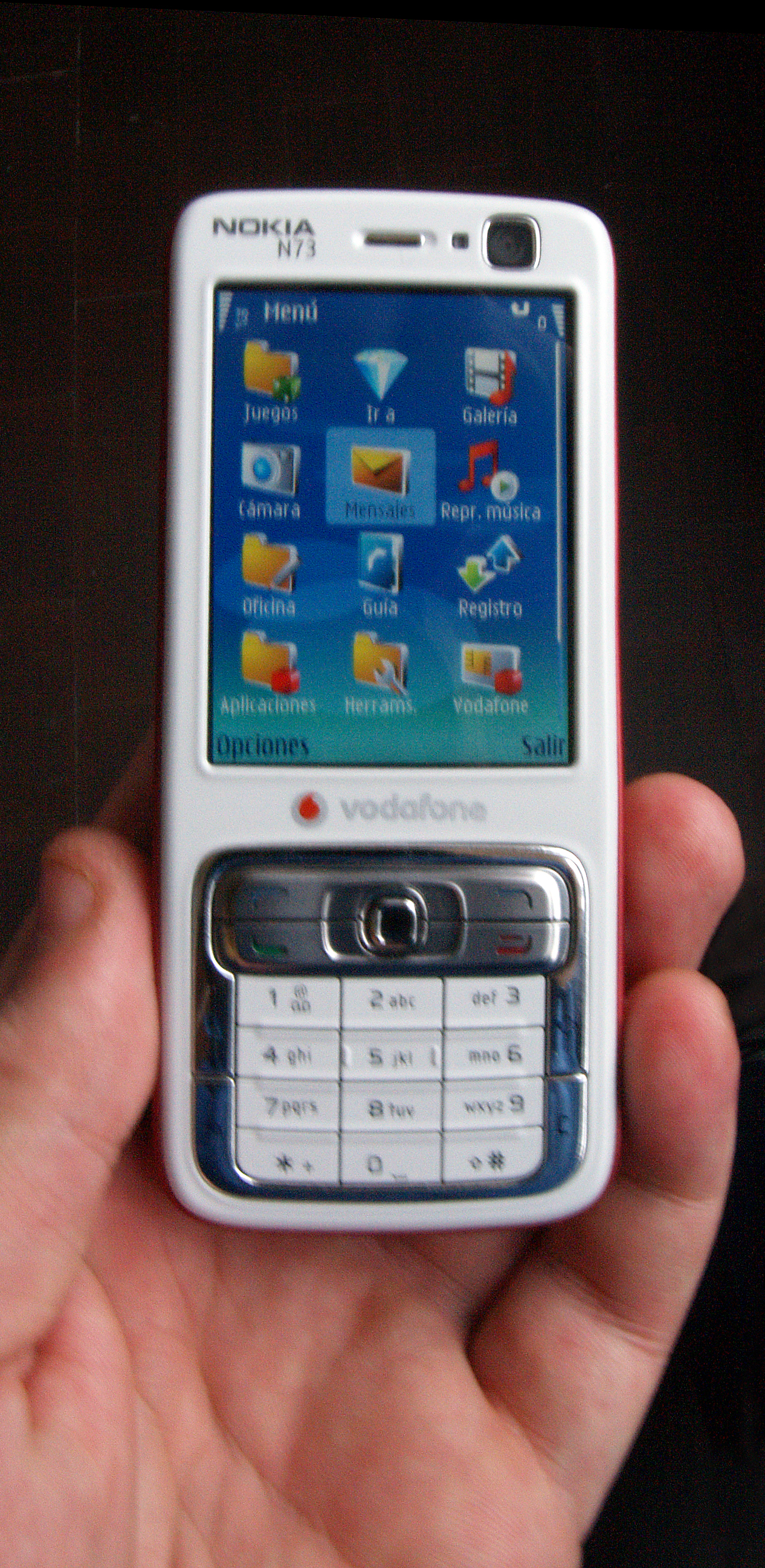 a closeup of a smart phone with someone holding it