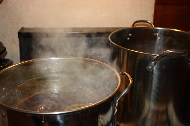 pots are steaming on the stove top