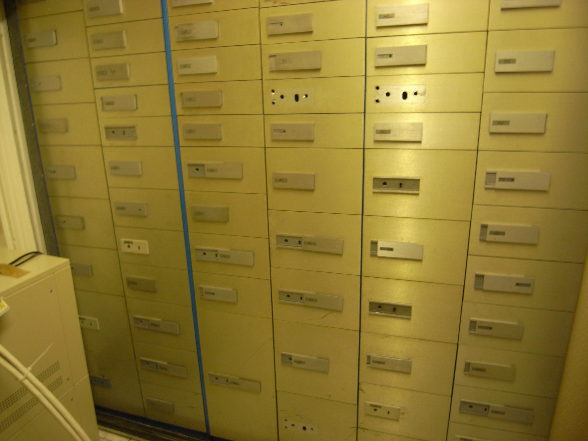 several rows of filing cabinets are stacked high