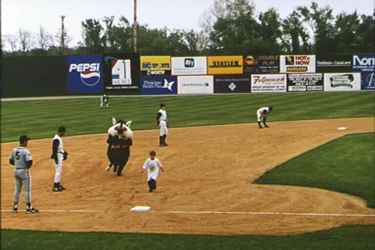 a team of baseball players playing baseball on a field