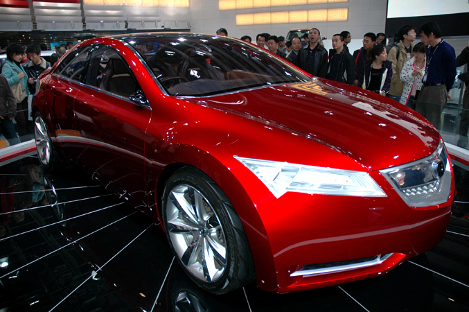 the new red model s electric car is on display