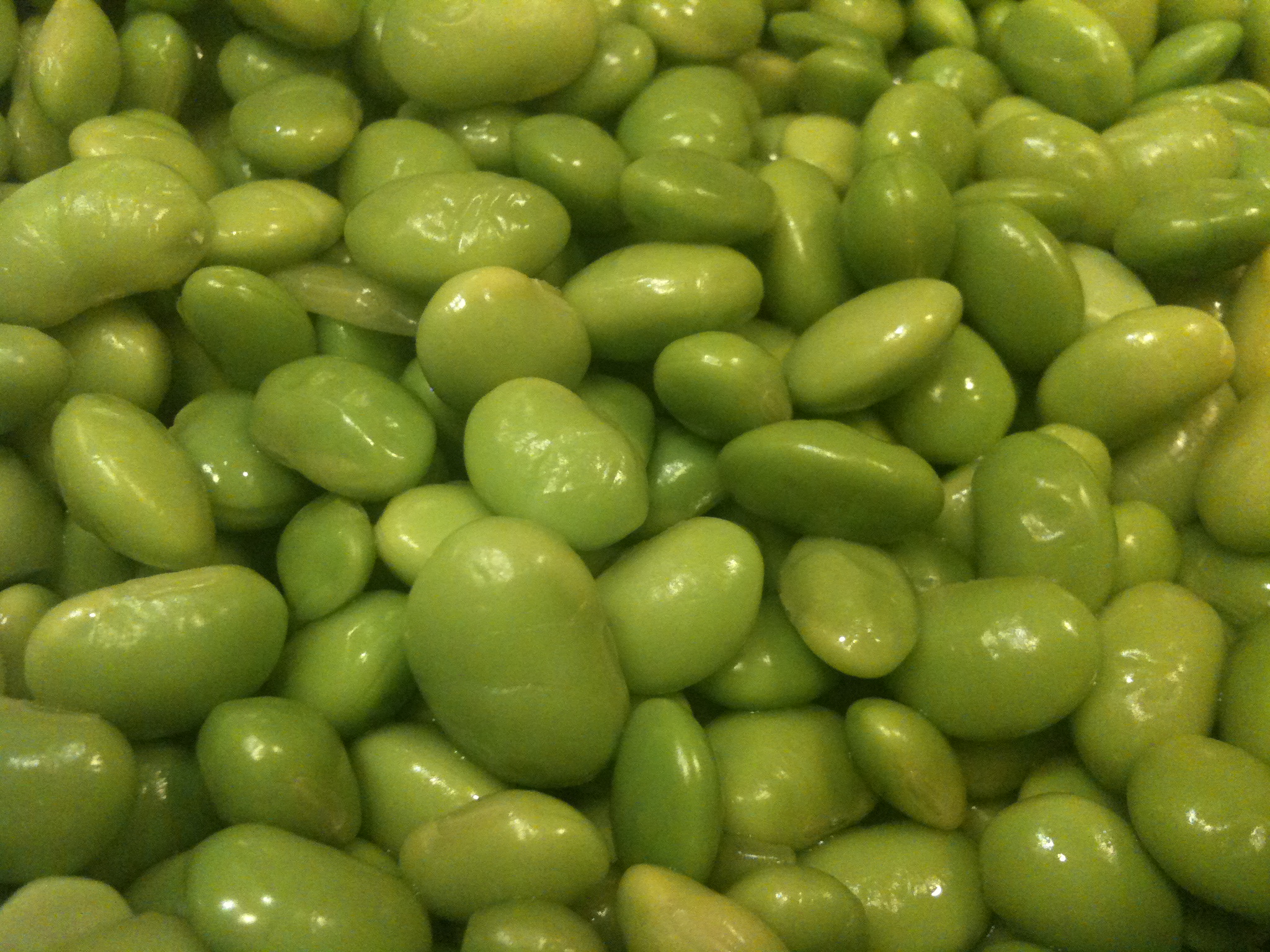 a pile of green pepper is in the bin