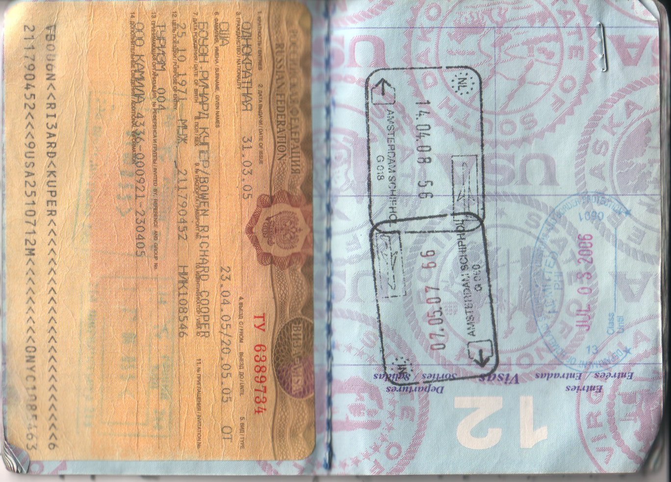 an old passport with stamps is opened