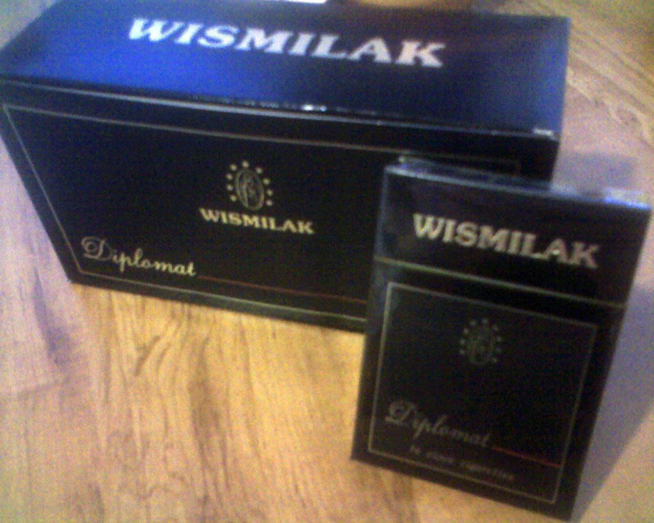 two boxes on a table with the word wsmilak printed in black