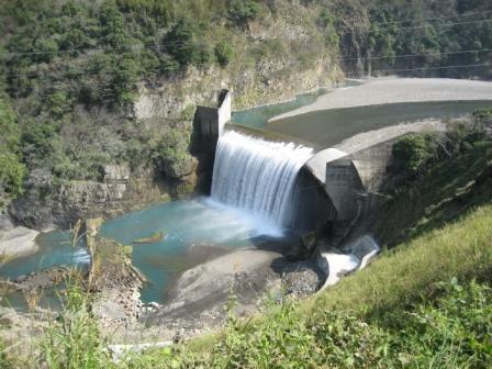 a small waterfall in the middle of a canyon