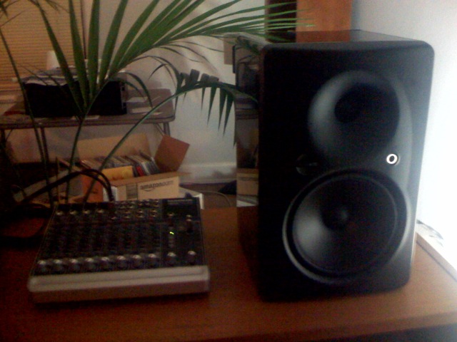 a close up of two speakers and a laptop