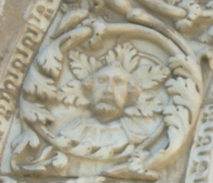 an ornate carving on the side of a building