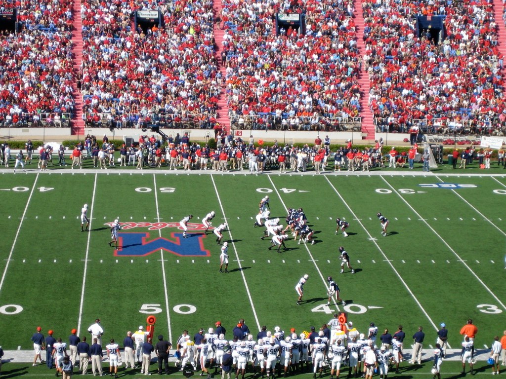 there are many people on the field playing a football game