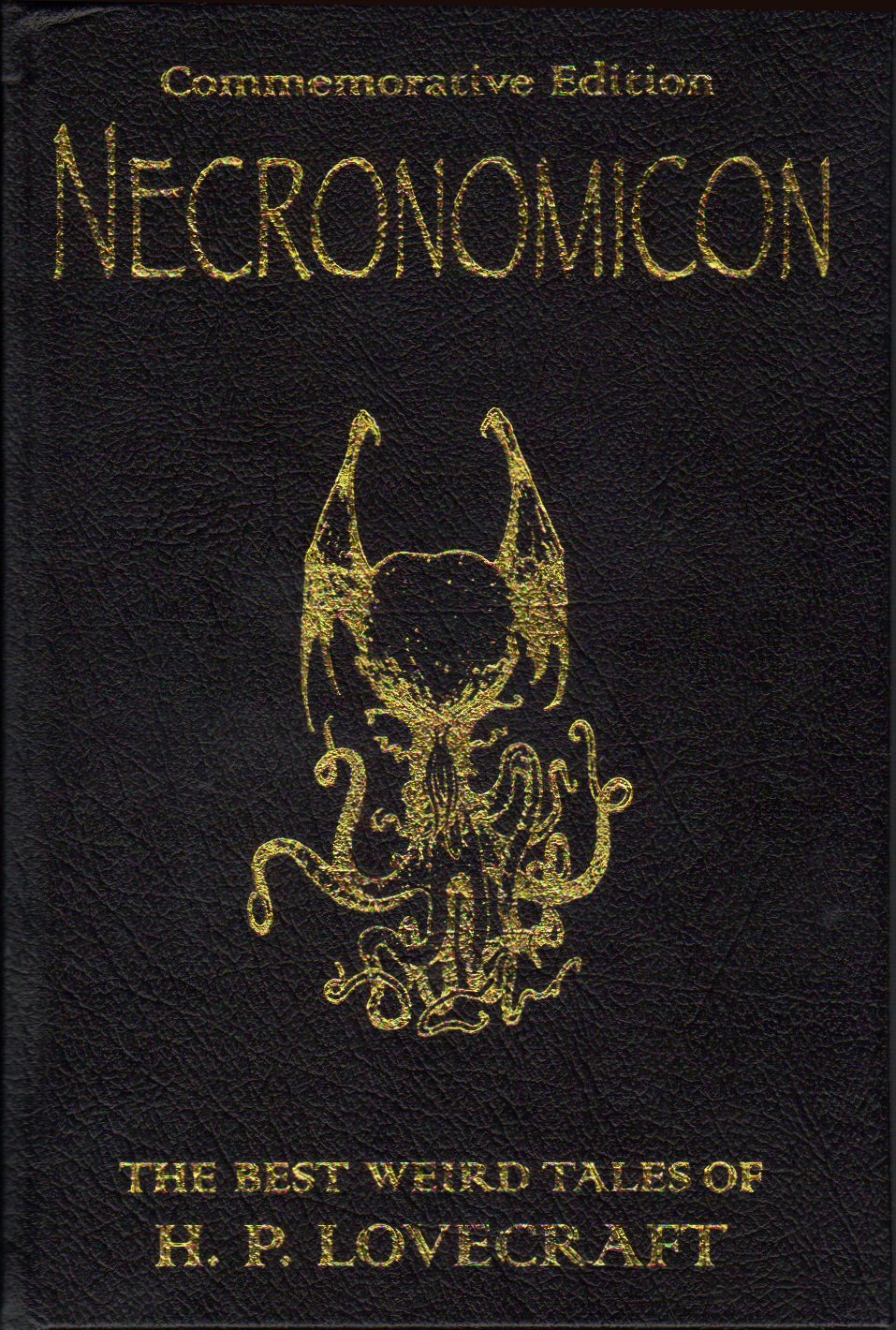 an old book with gold lettering that reads necronomicon