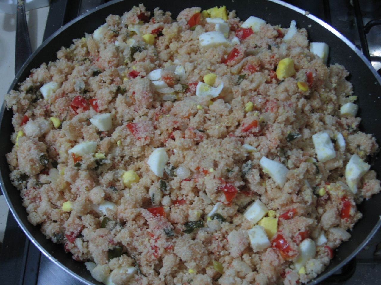 a mixture of vegetables and meat in a frying pan