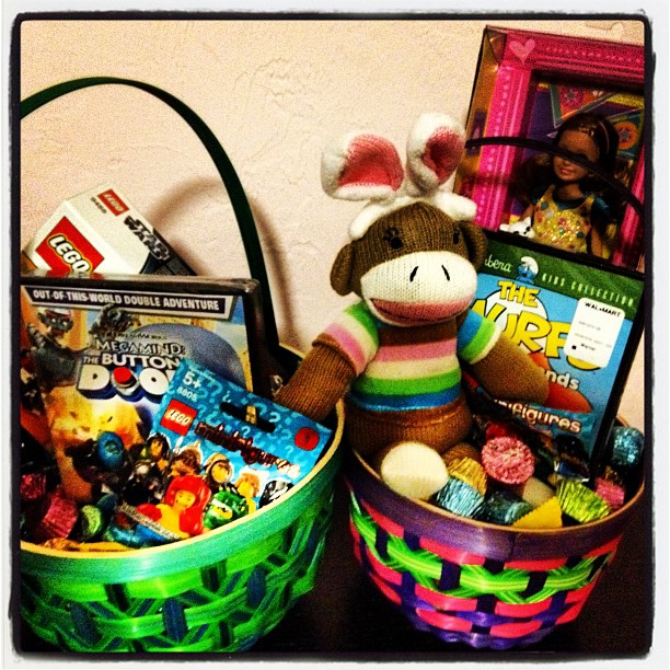 a stuffed animal sitting in a basket with toys