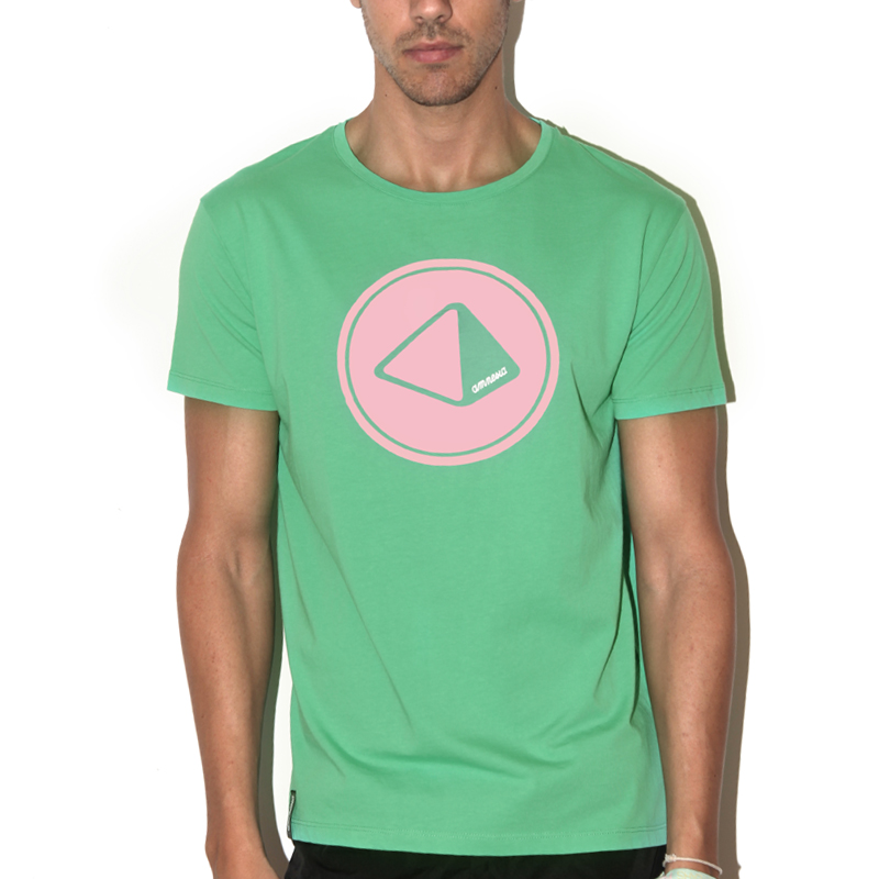 a man wearing a green t - shirt with the logo of an object in the center