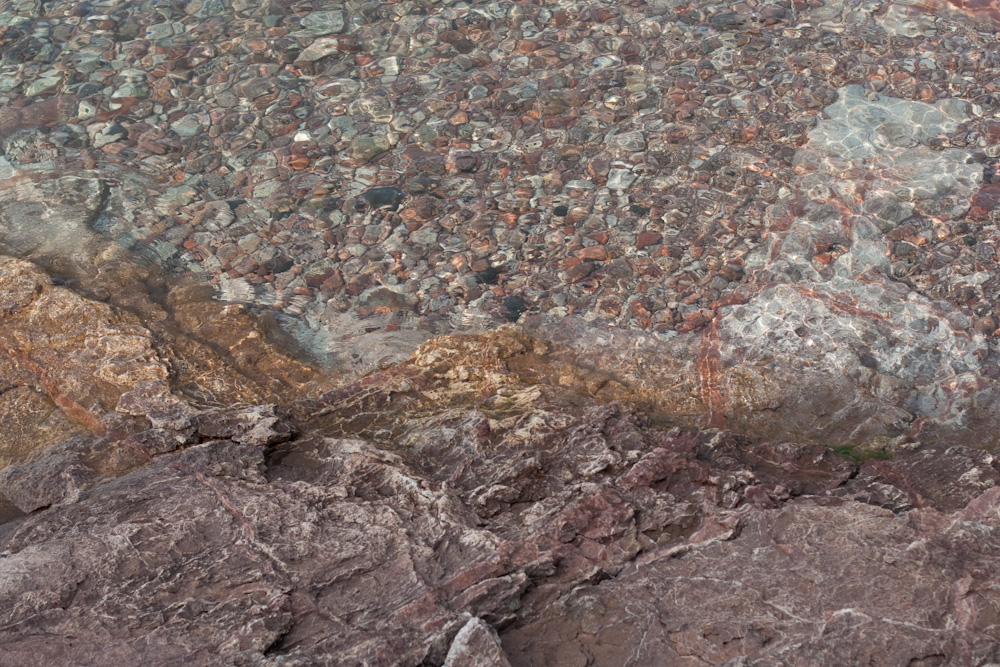 large rocks and small boulders in the water