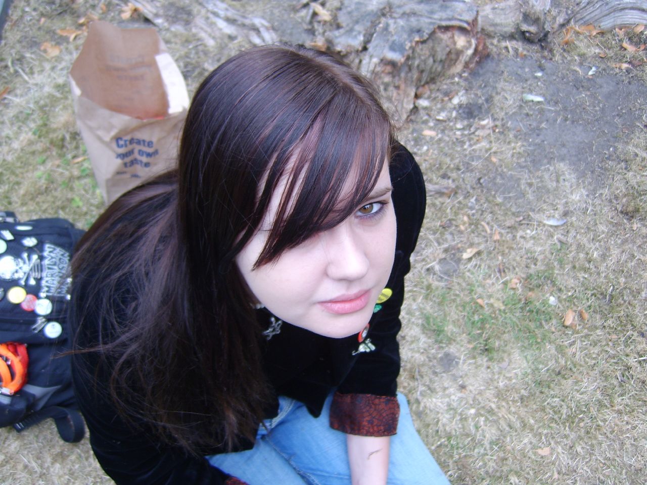 girl with brown hair in jeans and sweater