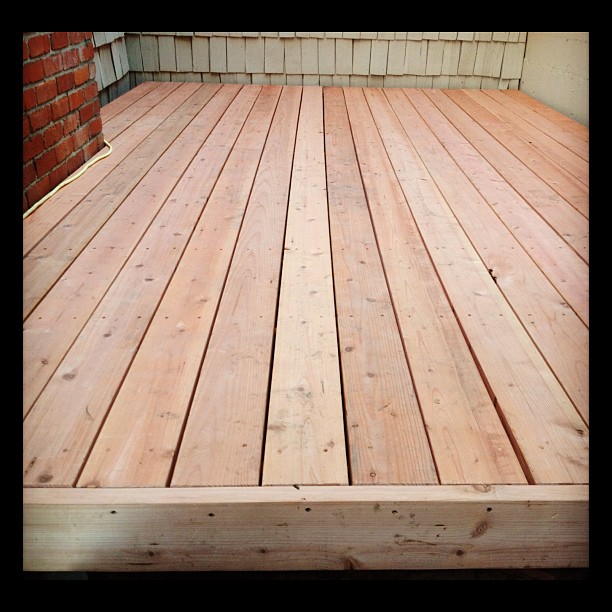 wooden planks are laid out to create a deck