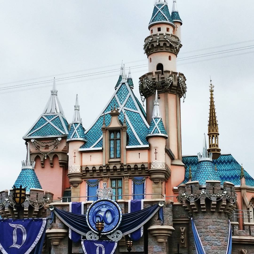 a building with a tall tower and a clock at the top